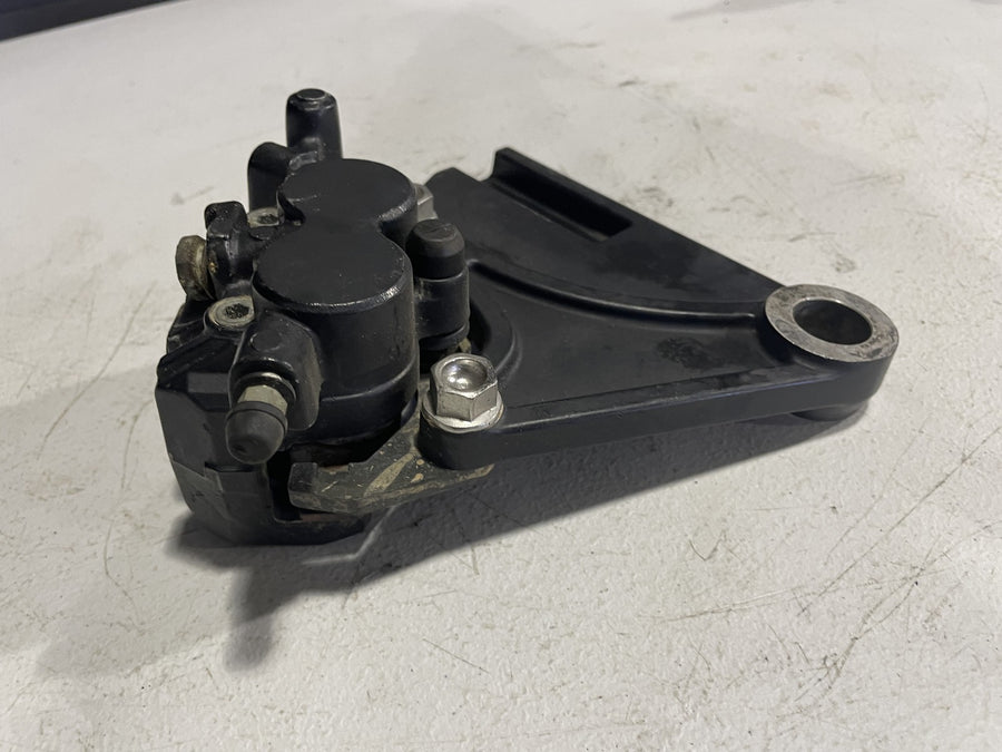 2006 TRIUMPH TIGER REAR BACK BRAKE CALIPER W MOUNT BRACKET