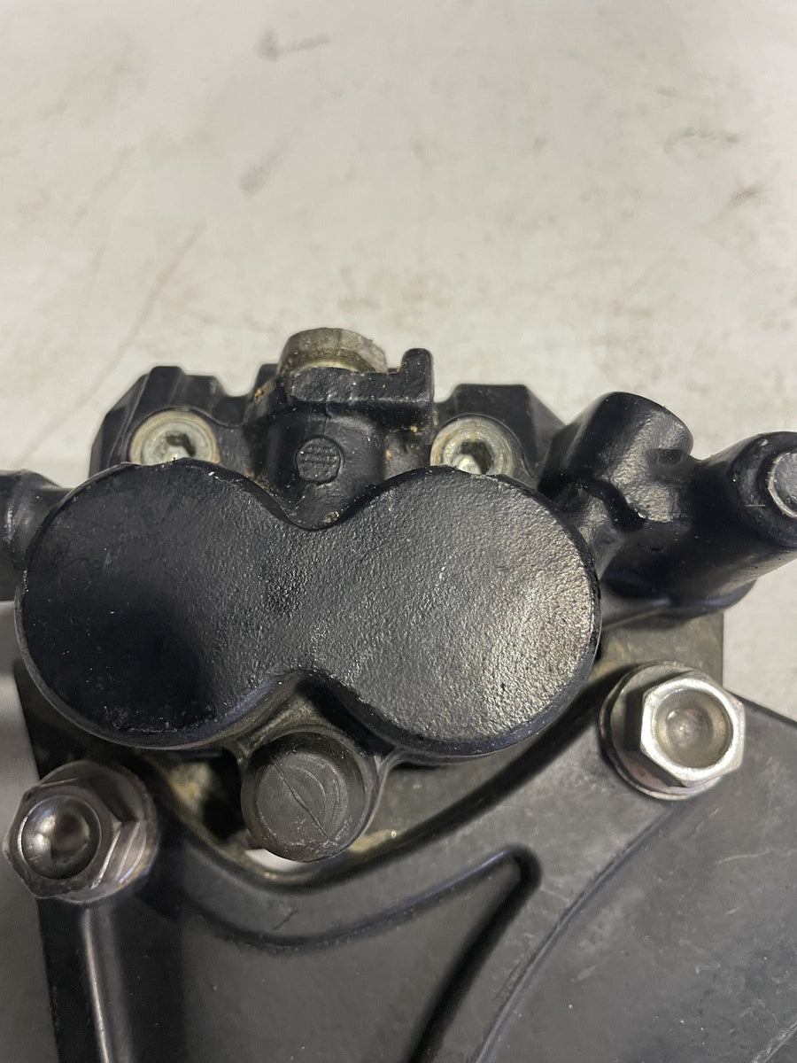 2006 TRIUMPH TIGER REAR BACK BRAKE CALIPER W MOUNT BRACKET