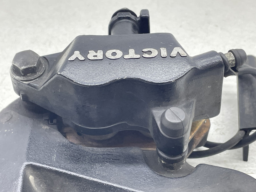 12-17 VICTORY CROSS COUNTRY TOUR REAR BACK BRAKE CALIPER W MOUNT BRACKET